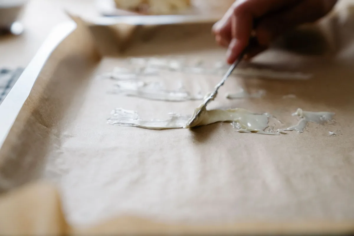 buttering a pan with butter stick